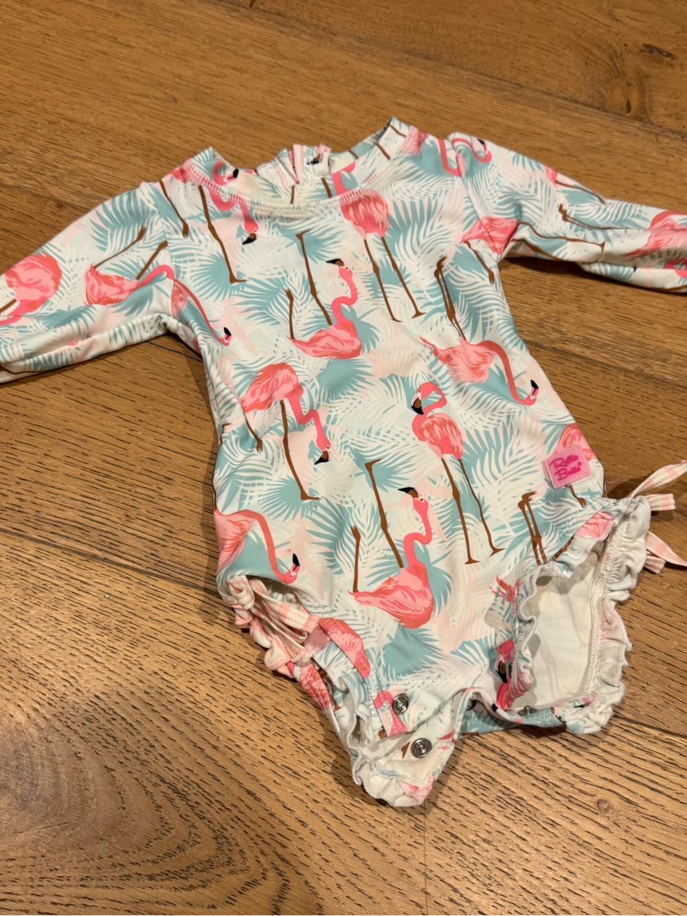 Ruffle Butts - Baby Long Sleeve One-Piece Swimsuit with Pink Flamingo Print -